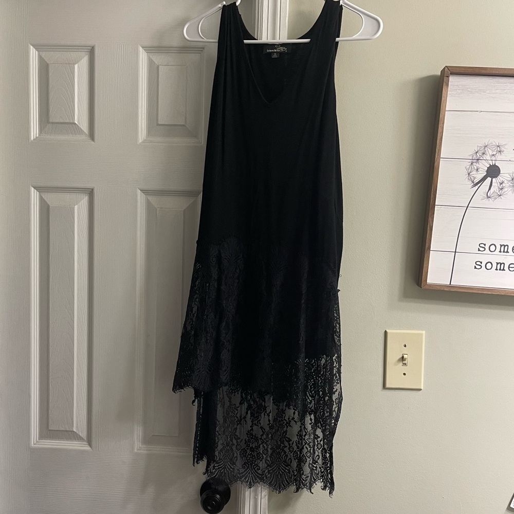 Women’s Top with lace at the bottom. Super Cute to layer or wear alone.